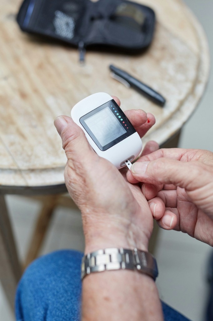 Checking blood sugar as part of a personal diabetes and cholesterol plan