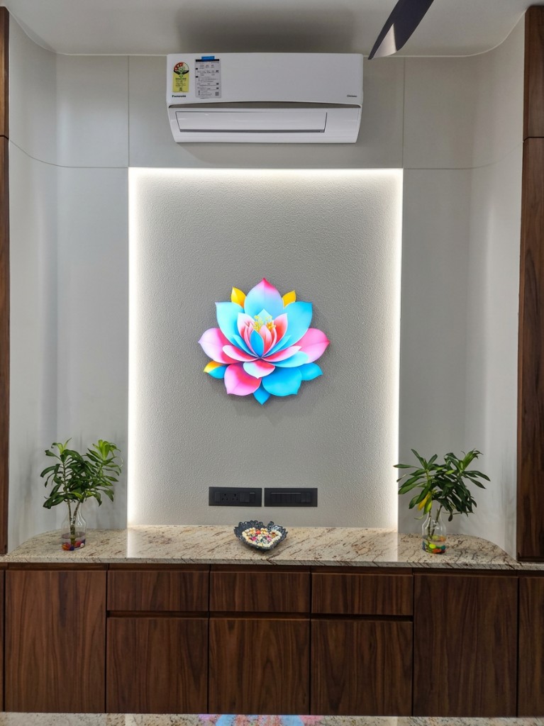 Illuminated lotus artwork in a recessed wall niche